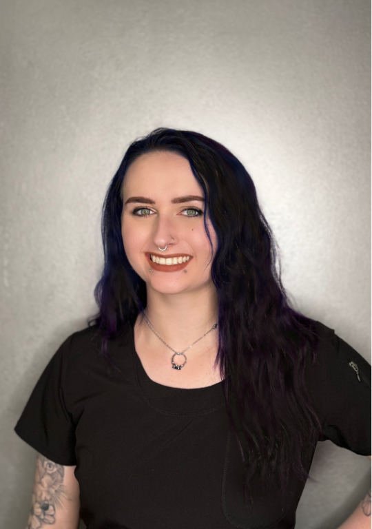 a woman with long hair wearing a black shirt